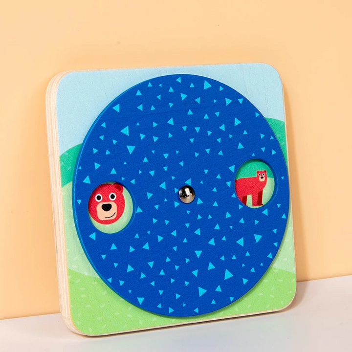 Animal-matching busy board with a blue rotating wheel and circular picture windows.