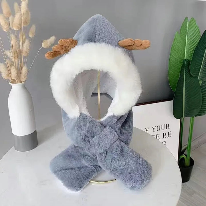 Blue antler baby hat with fluffy white trim and an integrated scarf