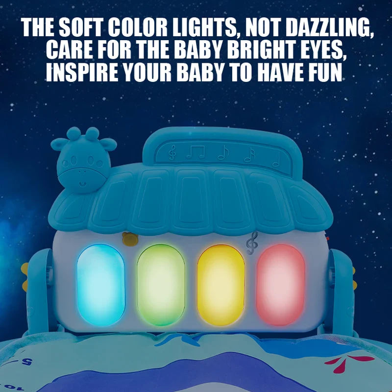 Blue baby gym piano with four illuminated keys against a dark background