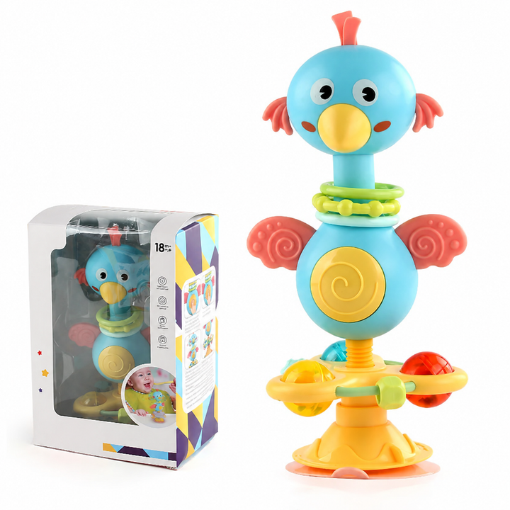 Blue bird rattle with colorful ball details on its play base, shown beside its box