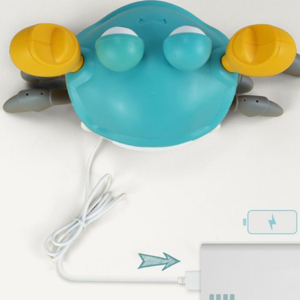 Blue crab toy connected to a USB charging cable, shown from above
