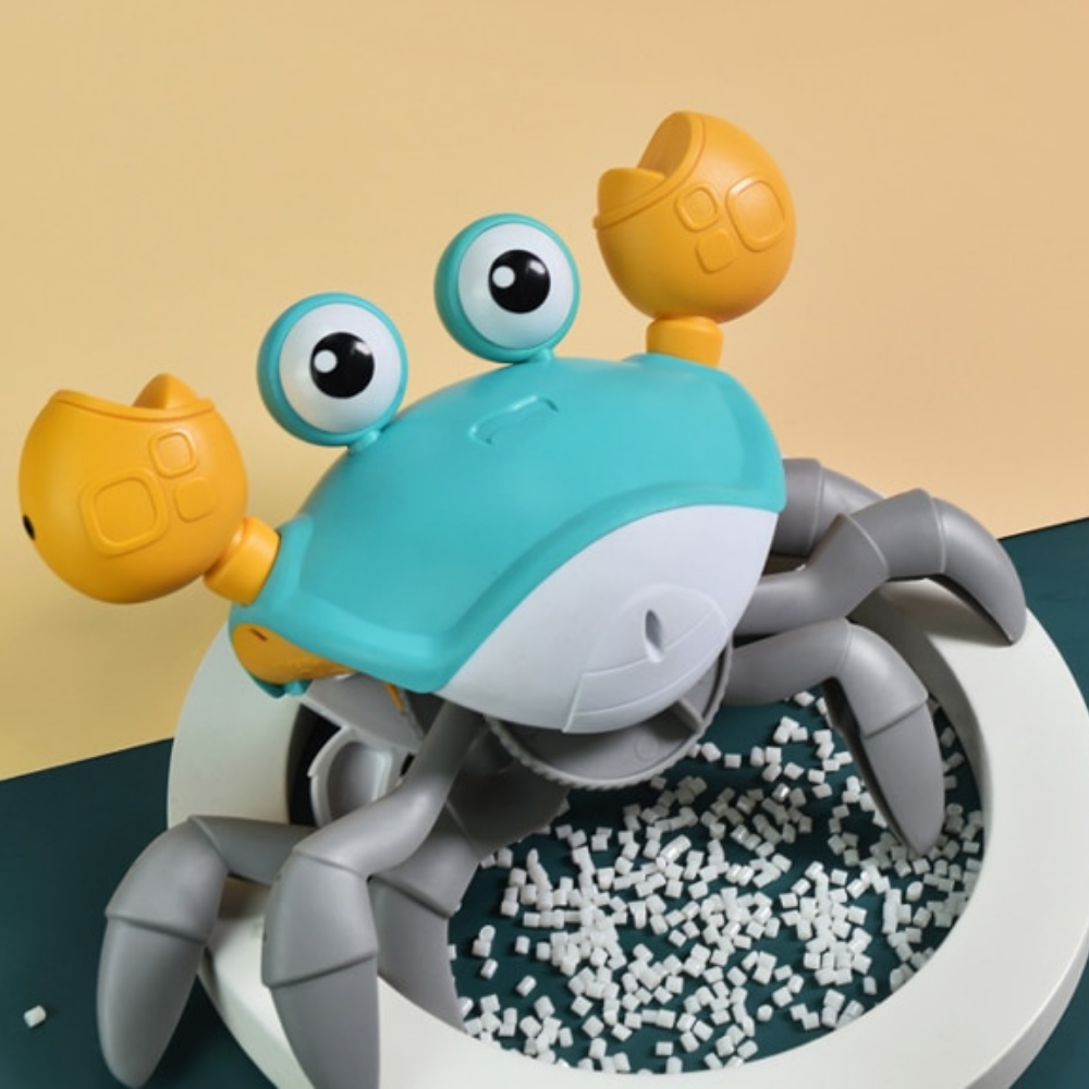 Blue crab toy posed above small white pellets