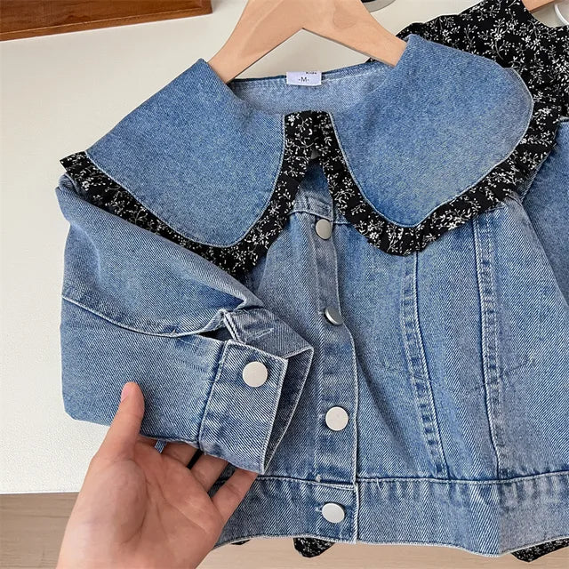 Blue denim jacket with a broad rounded collar and floral-edged trim