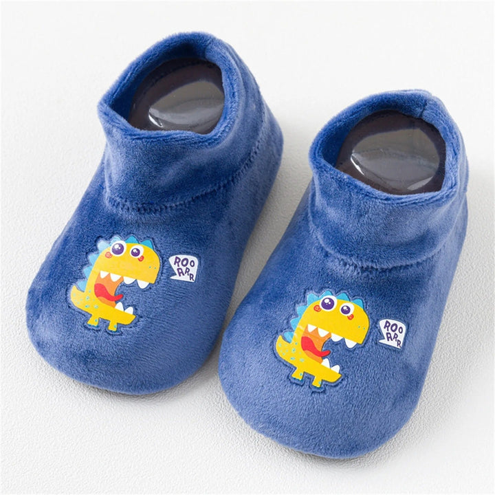 Blue sock shoes with yellow dinosaur prints