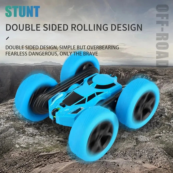 Blue RC stunt car with a double-sided rolling design on rocky terrain