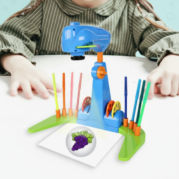 Blue drawing projector with a green base and a projected grape picture on white paper.