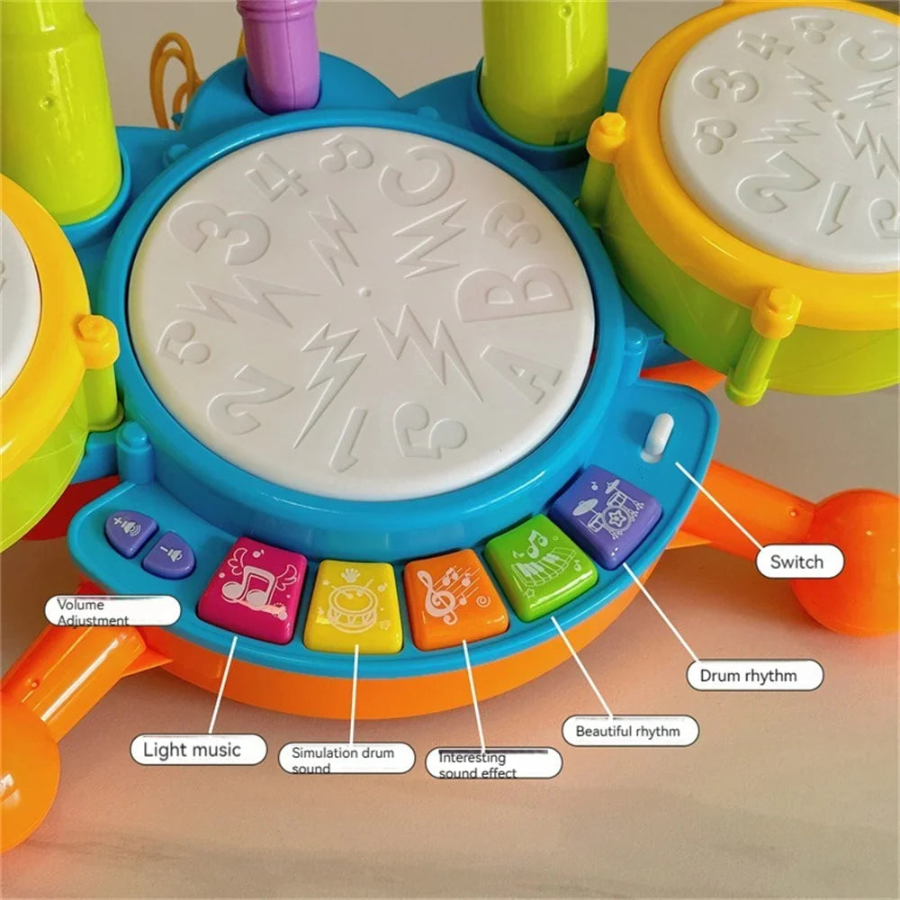 Blue toy drum set showing the center drum, colorful music buttons and volume controls