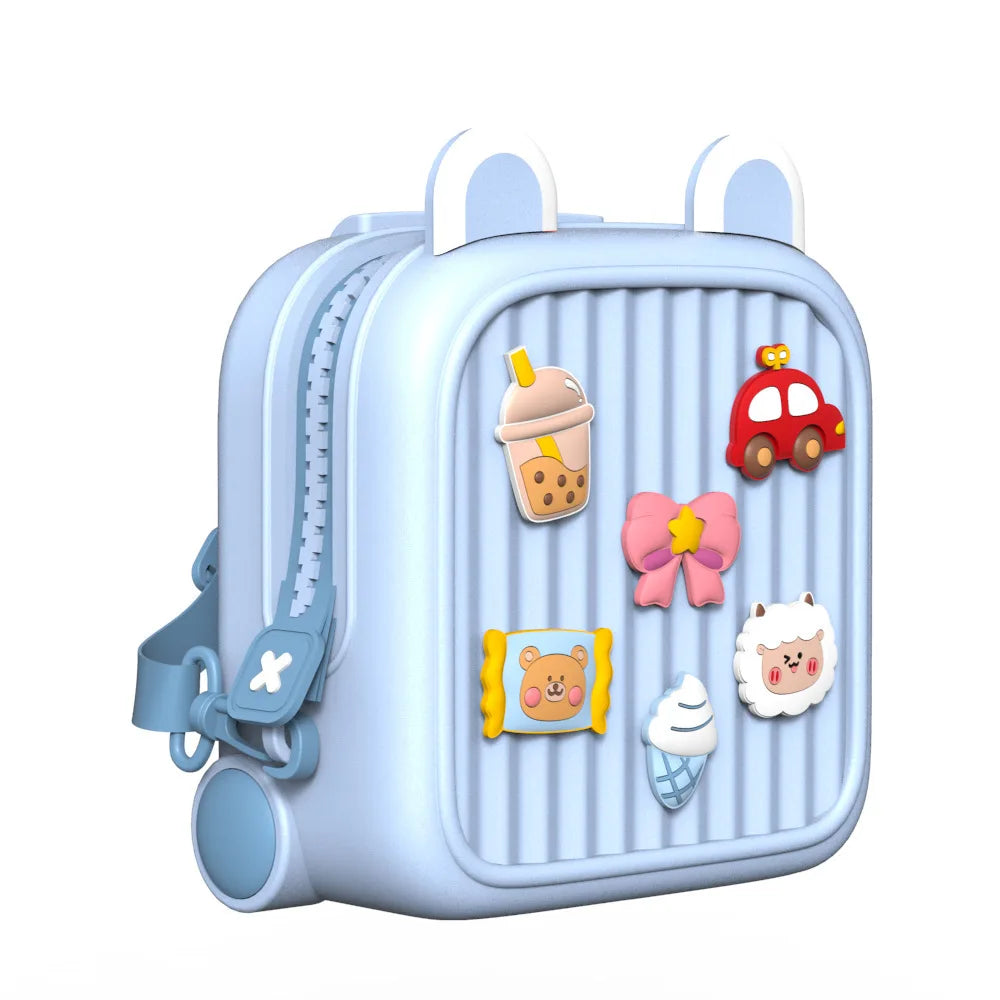 Blue children's backpack shown at an angle with raised decorations and an adjustable shoulder strap