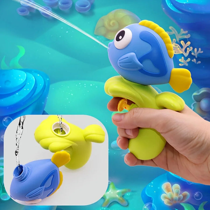 Hand holding a blue fish water squirter, with an inset showing the handle being refilled
