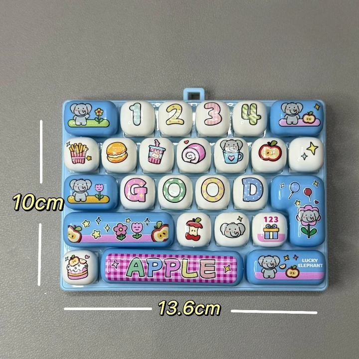 Blue fidget keyboard with food and letter keys, labeled 13.6 by 10 cm