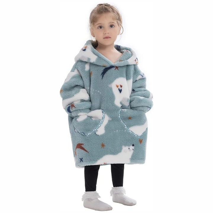 Child wearing a blue-gray polar bear-print hooded blanket