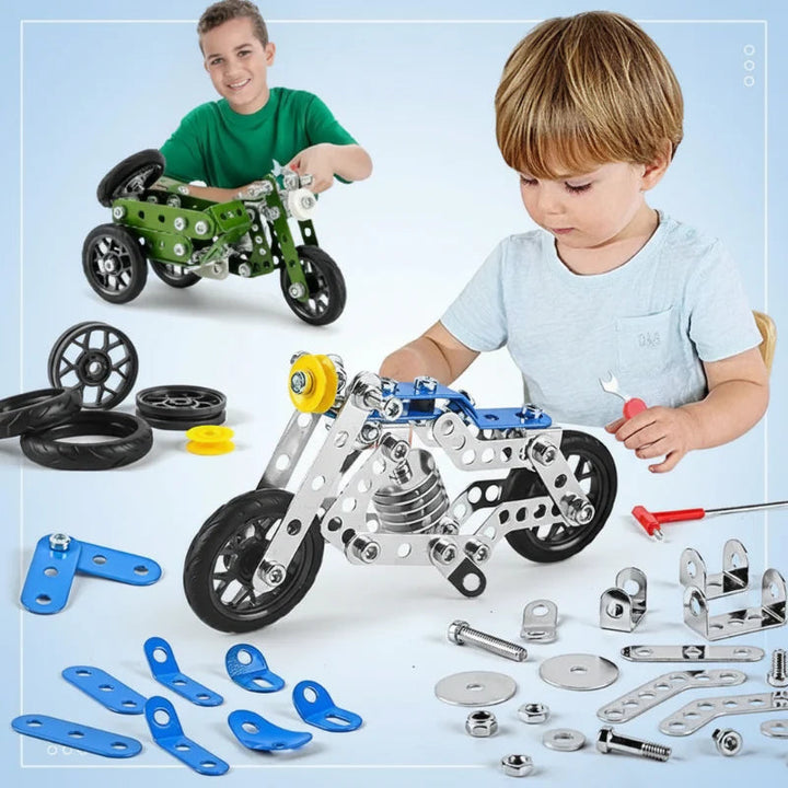 Children with blue and green motorcycle models, loose construction parts, wheels, and assembly tools