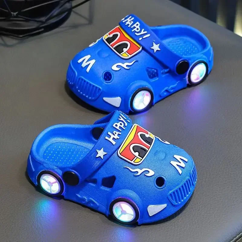 Blue car slippers with wheel-shaped LED lights and cartoon car faces.