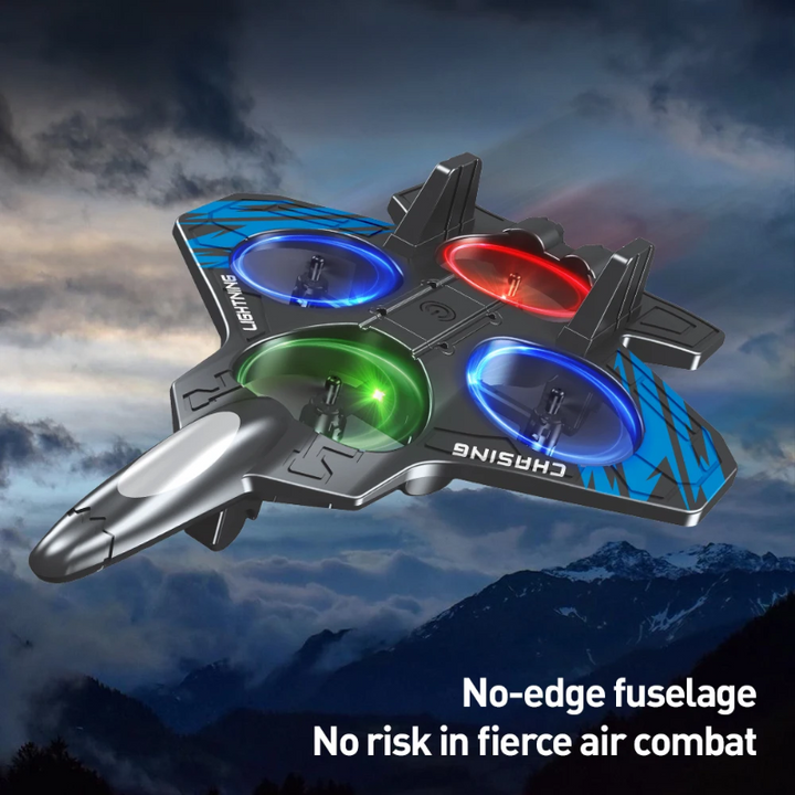Blue RC stunt plane with multicolored LED rings against a cloudy mountain background.
