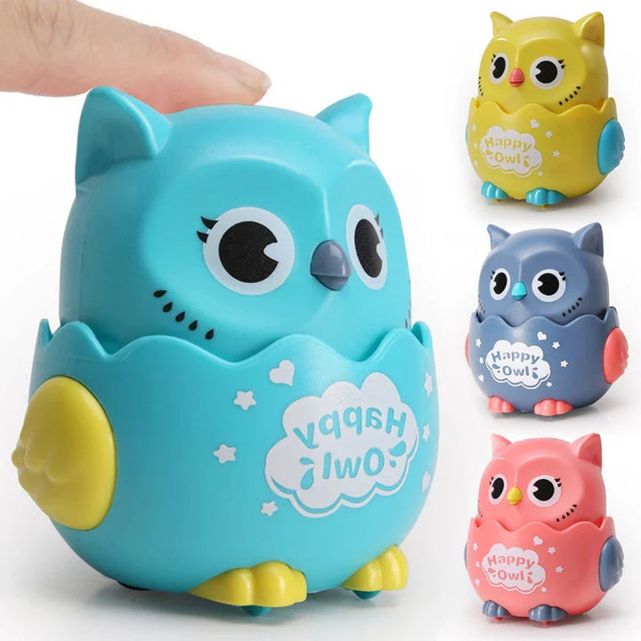 Hand pressing a blue owl toy car, with yellow, gray, and pink versions shown alongside.