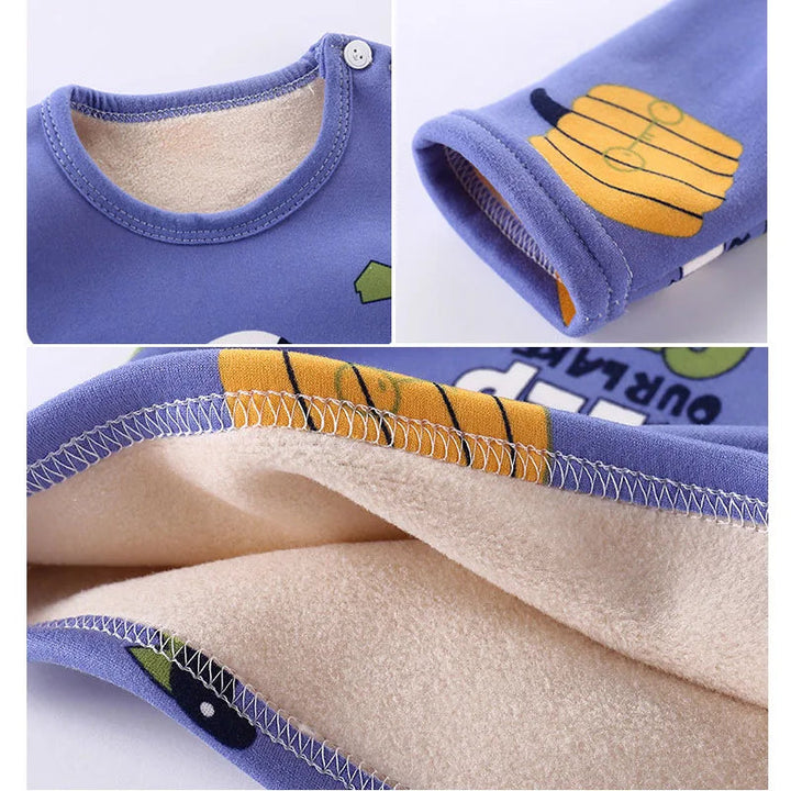 Blue pajama details showing shoulder snaps, sleeve stitching, and cream fleece lining