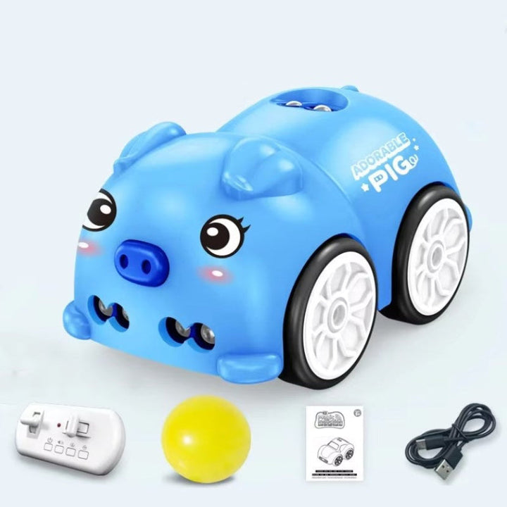 Blue piglet car with remote controller, yellow ball, charging cable, and instruction booklet