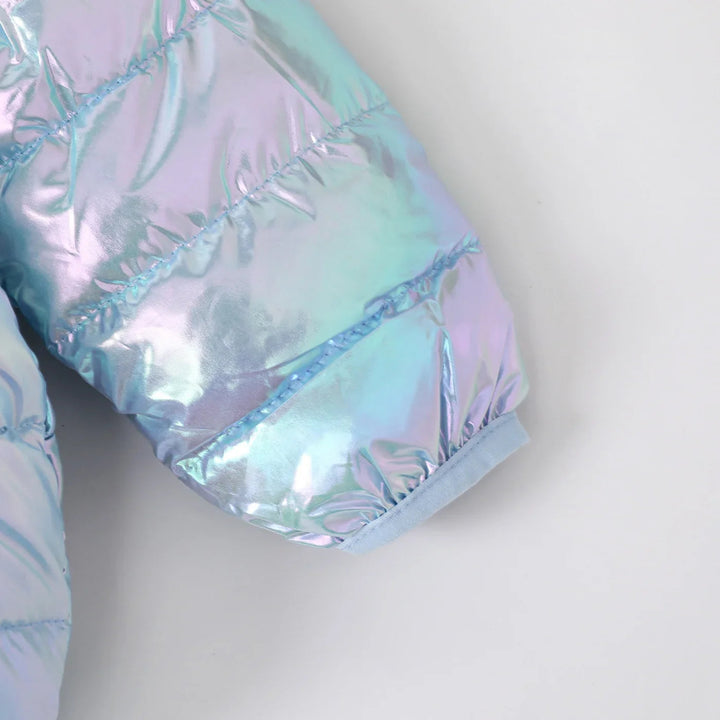 Close-up of a blue iridescent jacket sleeve with quilted padding and a bound cuff