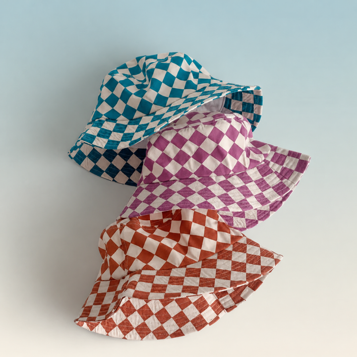 Blue, purple, and orange checkered bucket hats arranged together