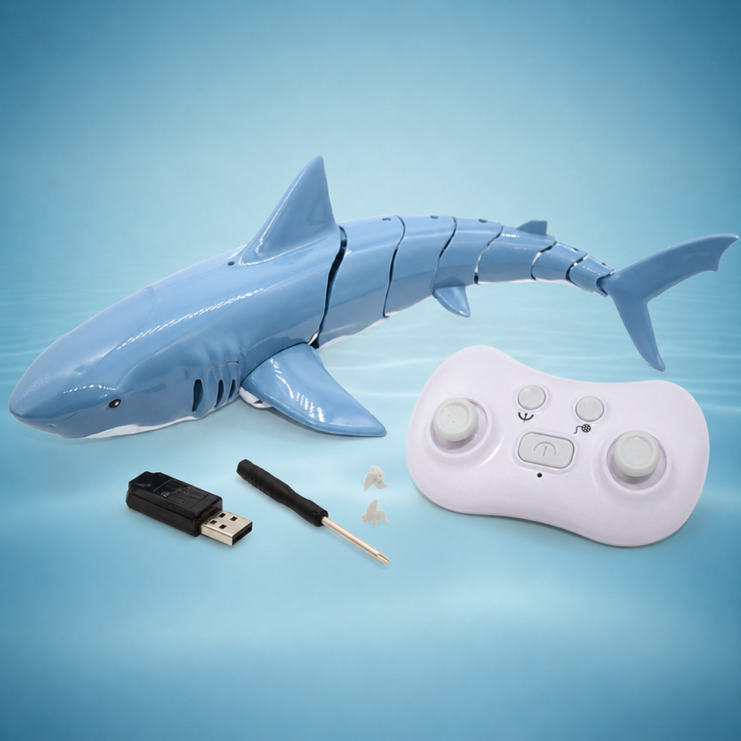 Blue RC shark with a white controller, USB charger, screwdriver and two propellers