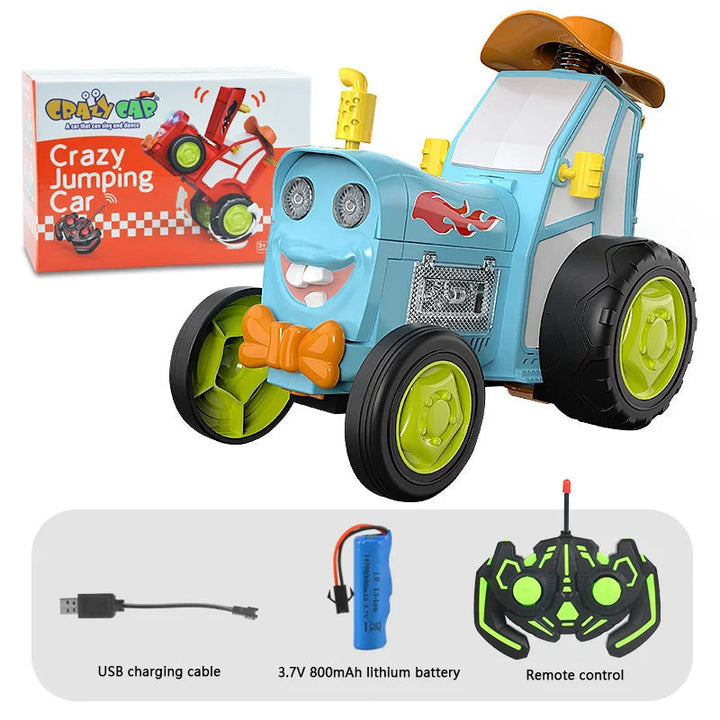 Blue RC stunt tractor beside its box, USB charging cable, rechargeable battery, and controller