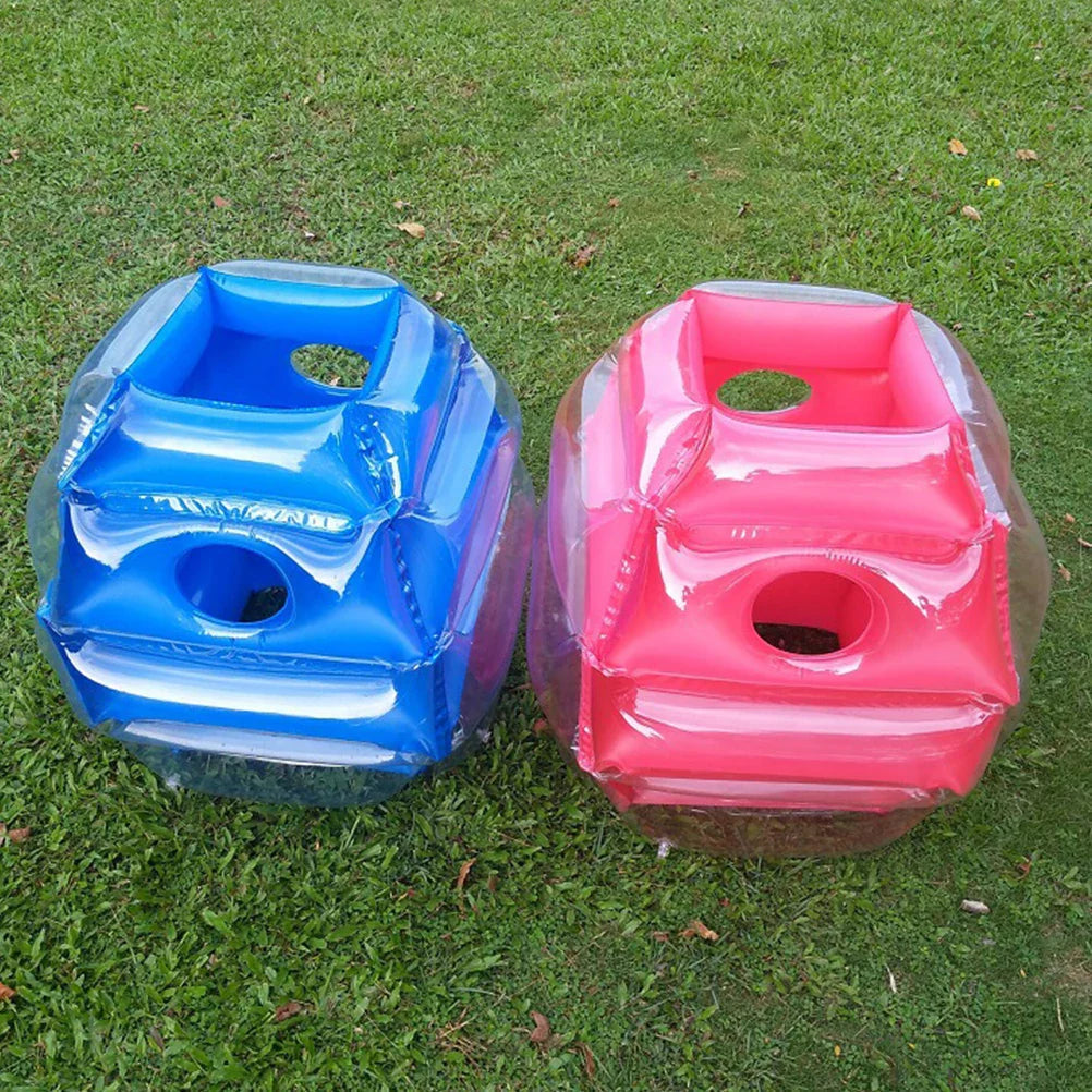 Blue and red inflatable play balls side by side on grass