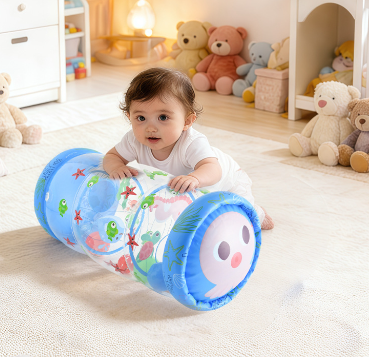 Baby playing on a rug with a blue inflatable roller decorated with sea-themed illustrations
