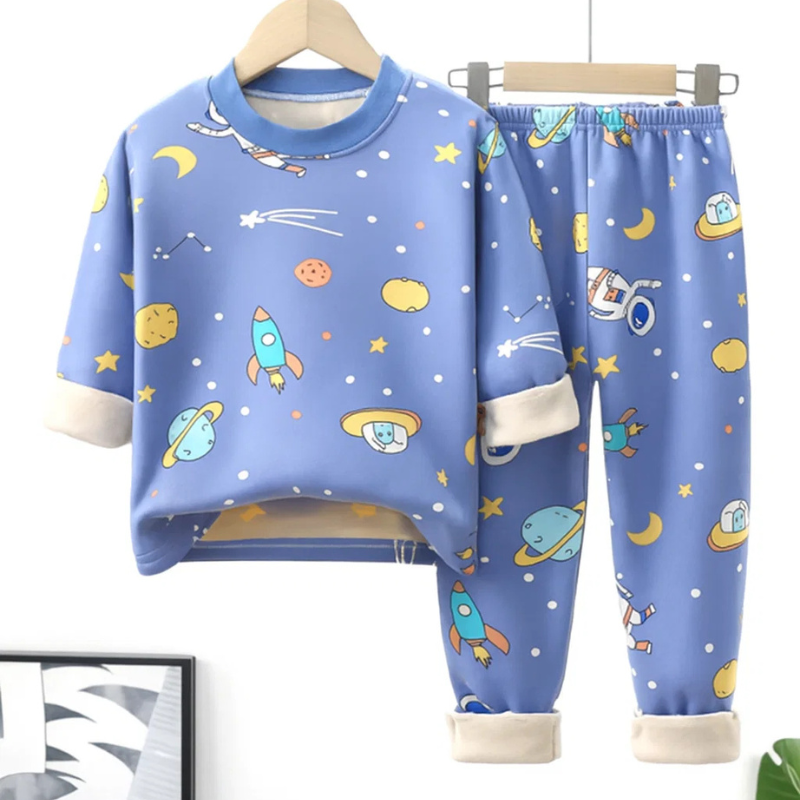 Blue space-print fleece pajama set with a long-sleeve top, matching pants, and cream cuffs