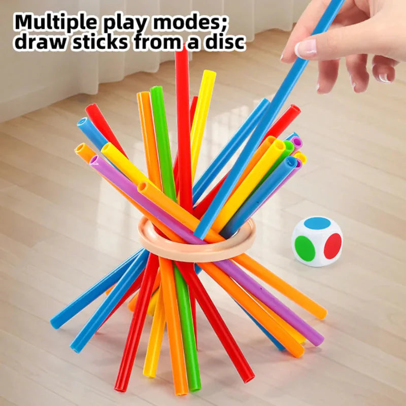 A hand lifting a blue stick from a colorful bundle held together by a circular ring