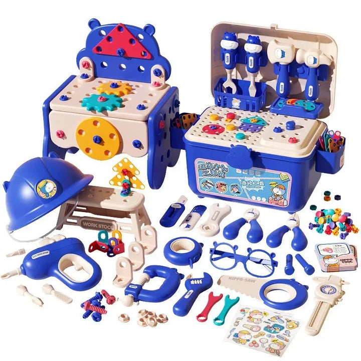 Blue toolbox and small workbench displayed with toy tools, building pieces, and pretend construction accessories