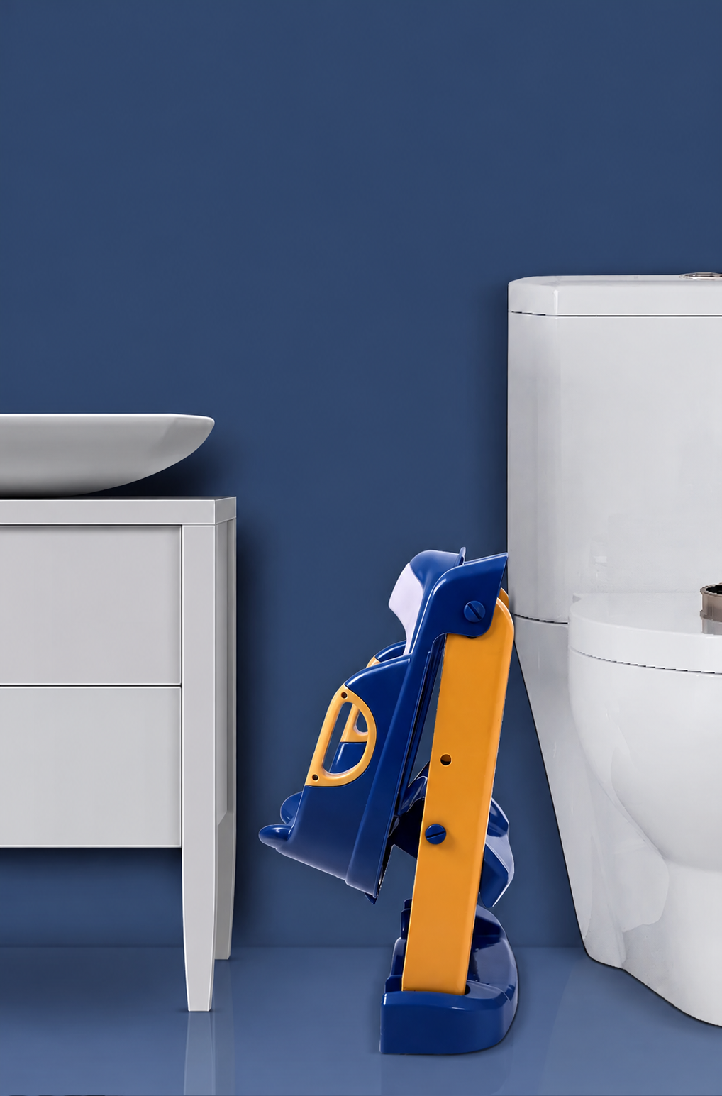 Blue and yellow toilet training seat folded beside a toilet