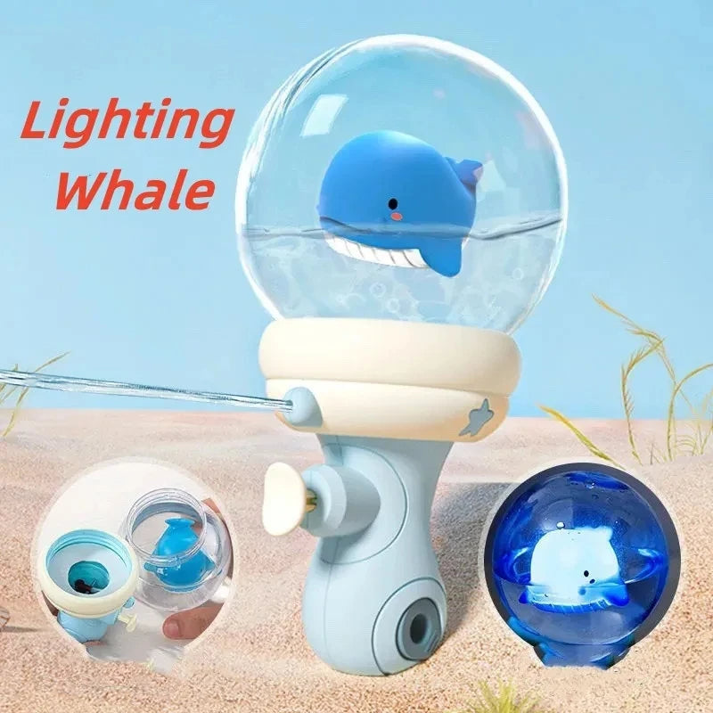 Blue whale water gun with a clear globe top and a blue-lit whale detail inset