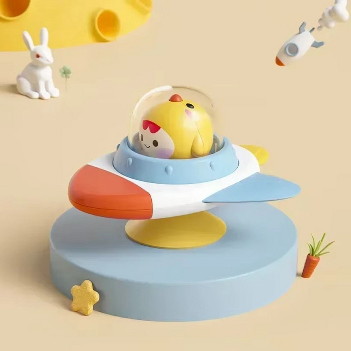 Chicken character under a clear dome on a rocket-shaped spinner with blue wings