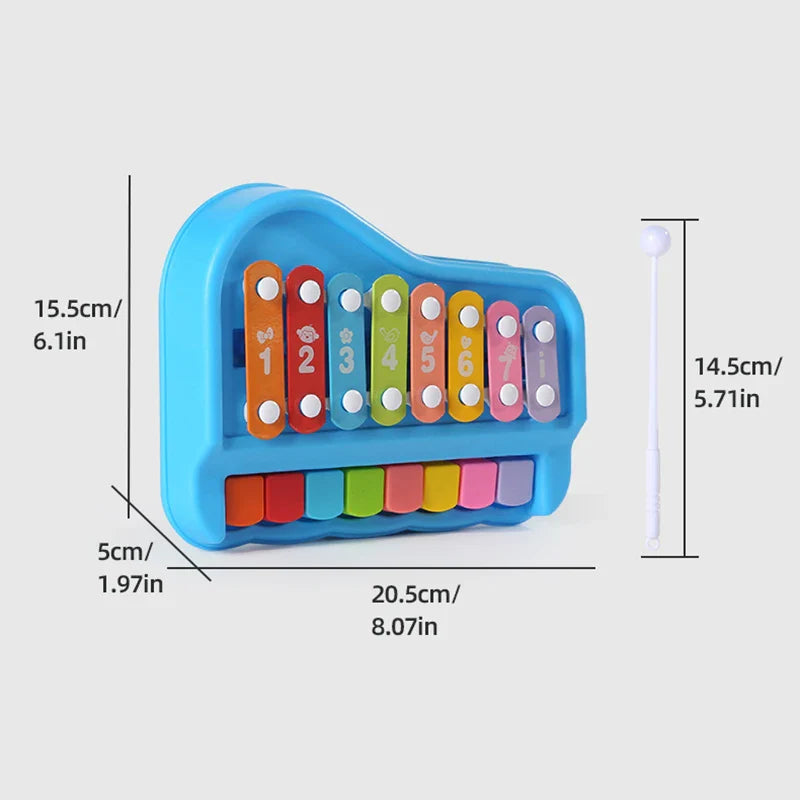 Blue xylophone and piano toy with measurements labeled in centimeters and inches