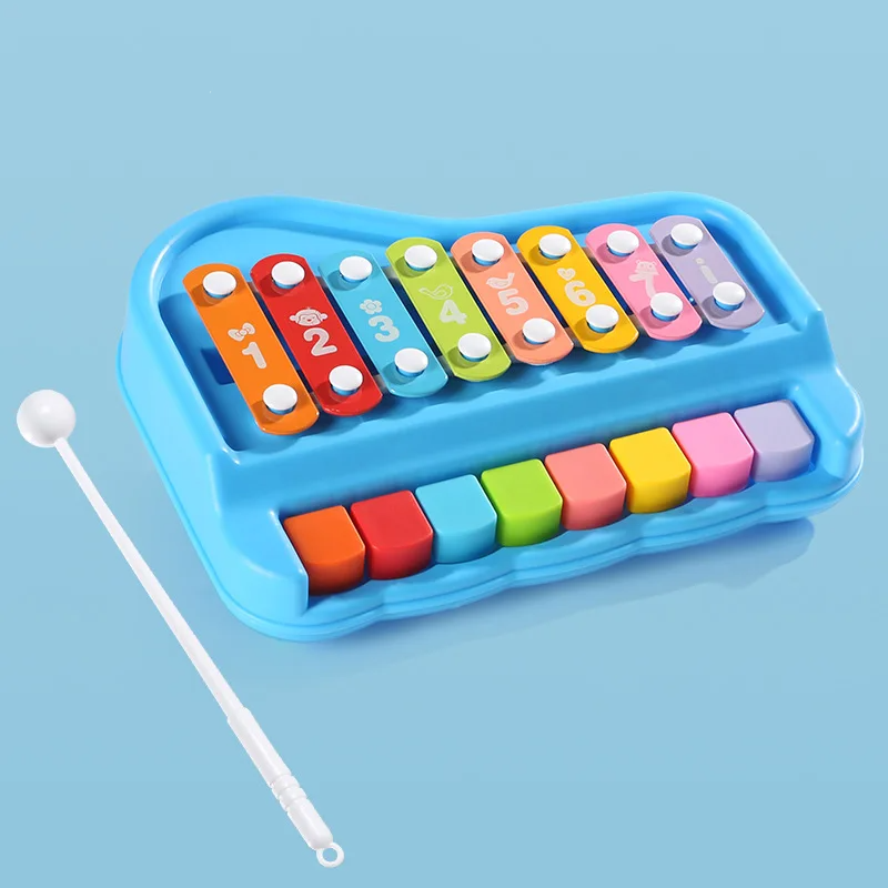 Blue xylophone and piano toy with eight colorful bars and a white mallet beside it