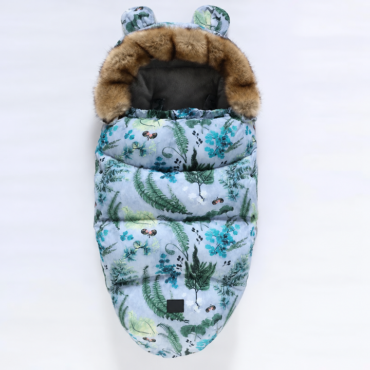 Botanical-print stroller footmuff with blue-green foliage and a faux fur collar
