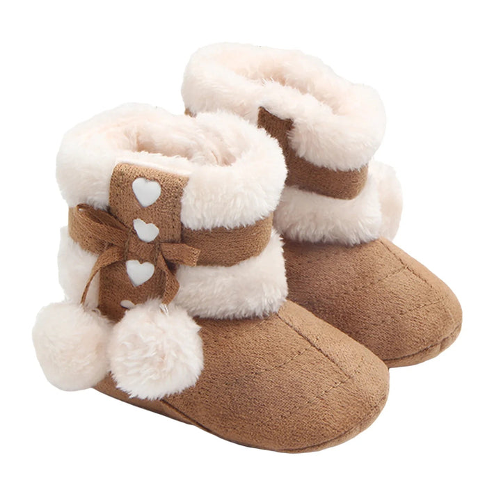 Brown baby snow boots shown as a pair with heart accents and fluffy cuffs