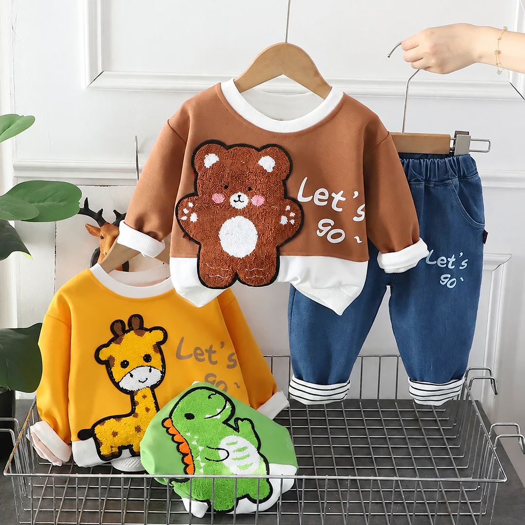 Brown bear sweatshirt and blue pants displayed with yellow giraffe and green dinosaur tops
