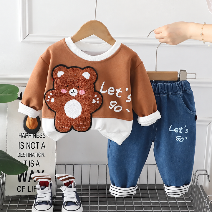 Brown bear sweatshirt with white trim and coordinating blue elastic-waist pants