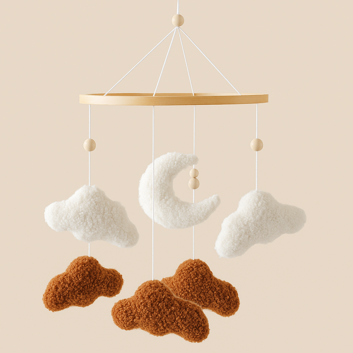 Brown and white cloud mobile with a crescent moon, wooden beads, and a wooden ring