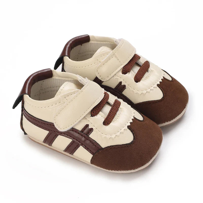 Brown and cream baby sneakers with contrast side stripes and fastening straps