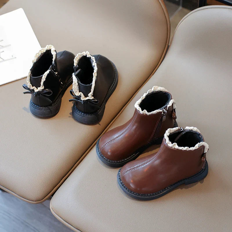 Brown boots shown from the front and black boots shown from the back