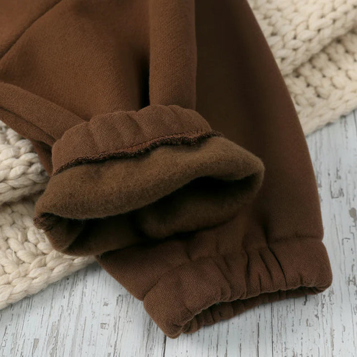 Brown jogger cuffs turned back to show the soft fleece lining