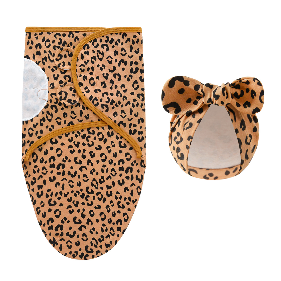Brown leopard-print swaddle blanket and matching bow hat with black markings