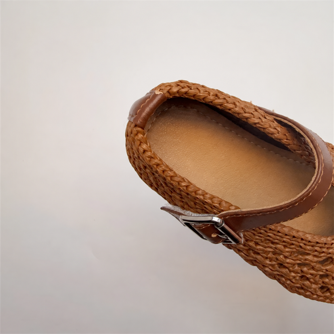 Close-up of a brown Mary Jane flat showing the interior and strap