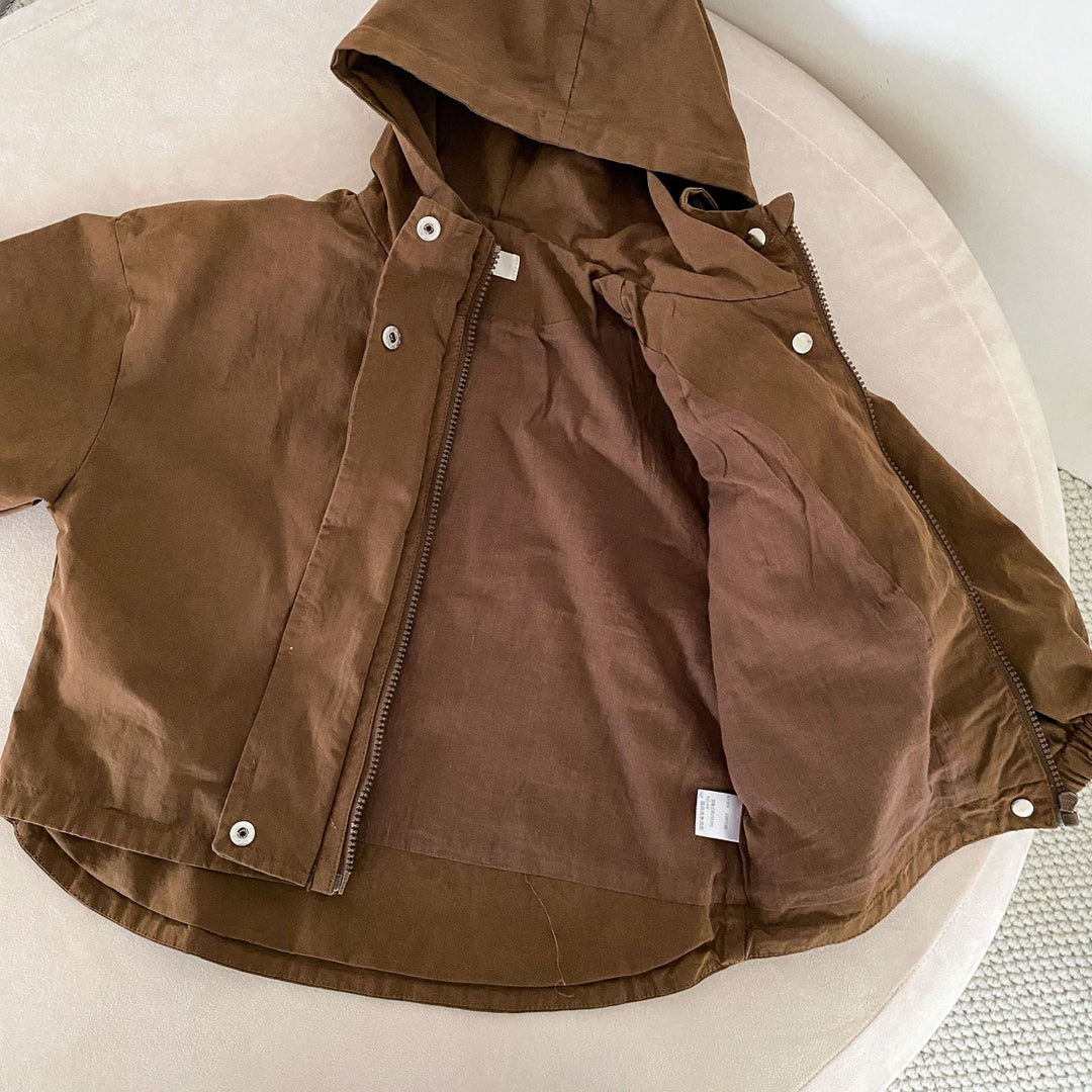 Brown hooded parka laid open to show the interior and curved back hem
