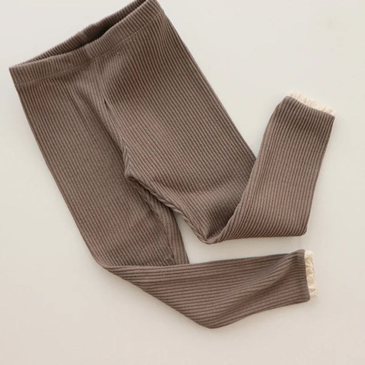 Brown ribbed leggings with an elastic waistband and lace-trimmed cuffs.