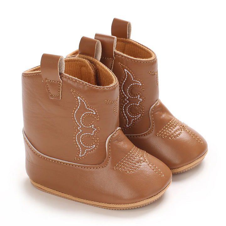 Brown baby cowboy boots with decorative western stitching and pull tabs