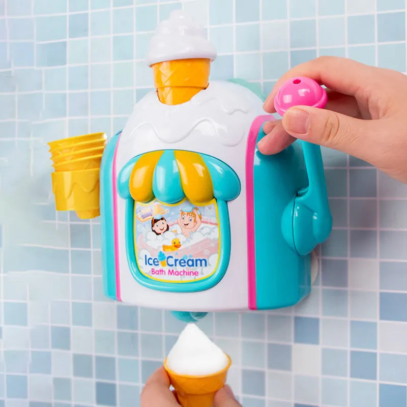 Hand pulling the pink handle of a wall-mounted bath toy while holding a yellow cone filled with foam
