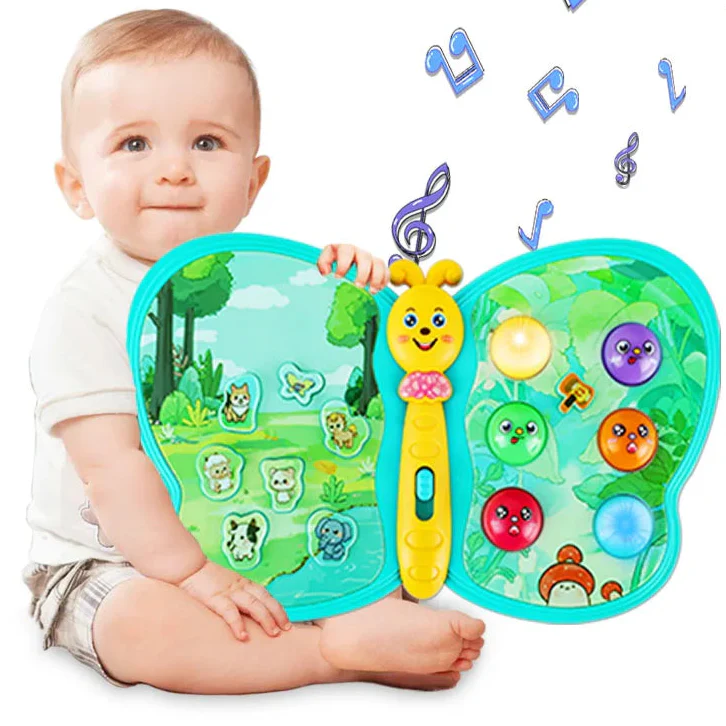 Baby holding a turquoise butterfly learning toy with animal buttons and colorful round buttons.